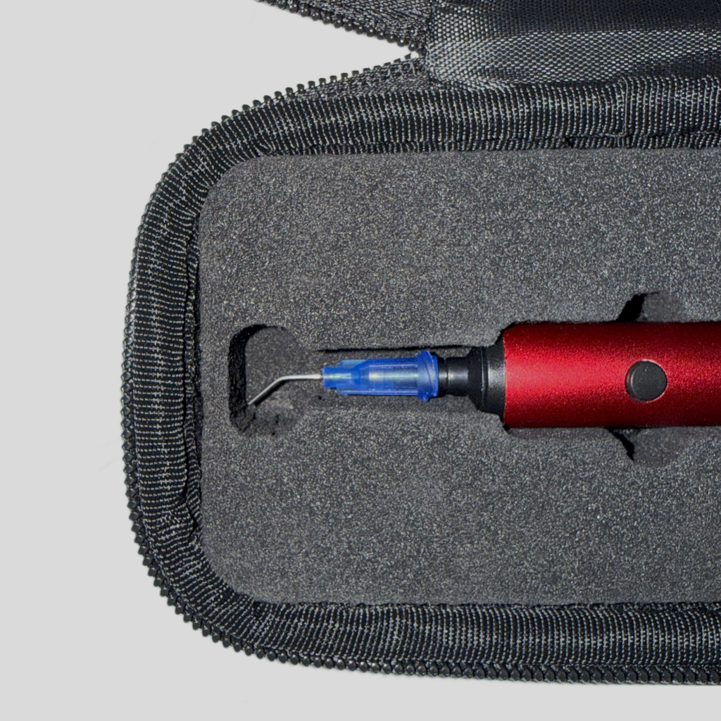 Close-up of the foam insert holding the Picograb V1 with a needle tip attached