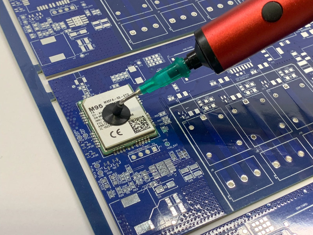 The 10 mm cup lifting a module off a blue PCB